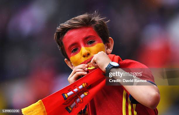 Young Spanish supporter kisses his country's badge prior to the UEFA EURO 2016 Group D match between Spain and Czech Republic at Stadium Municipal on...