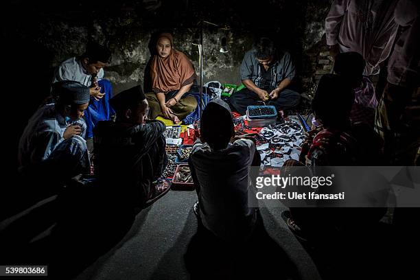 Students gather at a street vendor as they looking for prayer beads and other thing at the islamic boarding school Lirboyo during the holy month of...