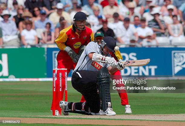 Neil Carter of Warwickshire is hit on the helmet by a delivery from Philip DeFreitas of Leicestershire while batting during the Twenty20 Cup...
