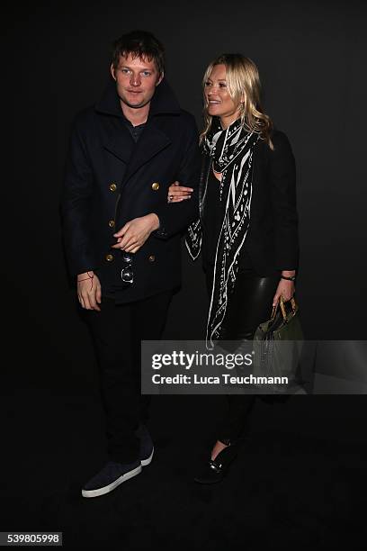 Nikolai von Bismarck and Kate Moss attend the Coach show during The London Collections Men SS17 at on June 13, 2016 in London, England.