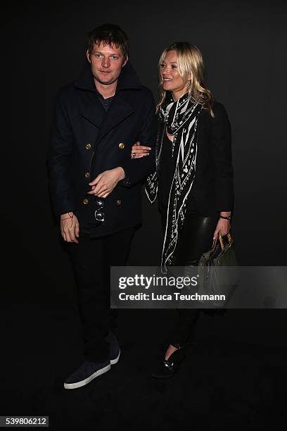 Nikolai von Bismarck and Kate Moss attend the Coach show during The London Collections Men SS17 at on June 13, 2016 in London, England.