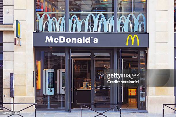 mcdonald's restaurant in paris - compere stock pictures, royalty-free photos & images