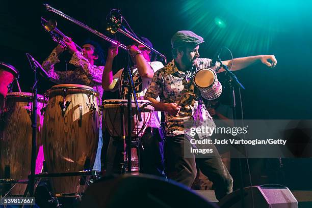 Brazilian musician Romulo Nardes plays percussion as he performs with the Afrobeat band Bixiga 70 at the 12th Annual GlobalFest on the Ballroom Stage...