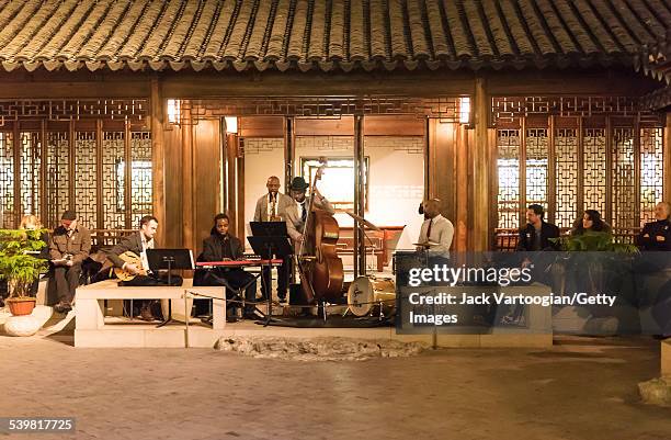 American Jazz musician Ben Williams plays upright acoustic bass as he leads his band, Sound Effect, as they perform at 'Jazz and Colors at the Met:...