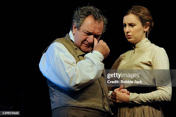 Ken Stott as Uncle Vanya and Laura Carmichael as Sonya in Anton Chekhov's Uncle Vanya directed by Lindsay Posner at the Vaudville Theatre in London.