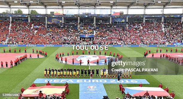 The two teams listen to their respective national anthems during the Euro 2016 group D football match between Spain and Czech Republic at the Stadium...