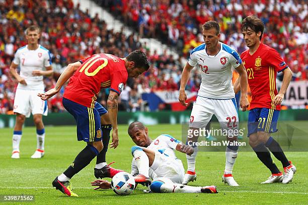 Theodor Gebre Selassie of Czech Republic and Cesc Febregas of Spain compete for the ball during the UEFA EURO 2016 Group D match between Spain and...