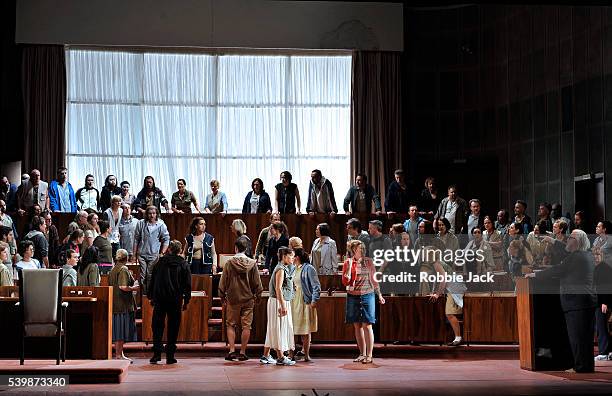 Rainer Trost as Aron and John Tomlinson as Moses with artists of the company in Welsh National Opera's production of Arnold Schoenberg's Moses und...