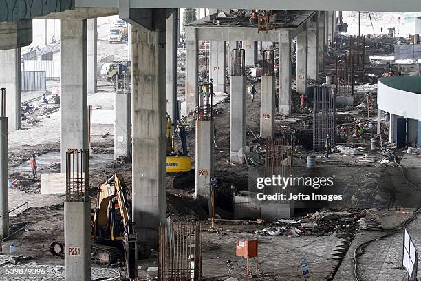 Workers completed the new terminal construction project at Soekarno-Hatta International Airport on June 12, 2016 in Tangerang, Indonesia. The...