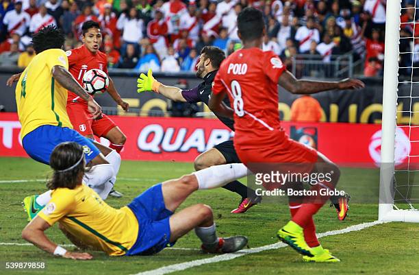 Peru's Raul Ruidiaz takes a pass from teammate Andy Polo and beats a lunging Brazil goal keeper Alisson for the only goal of the game late in the...