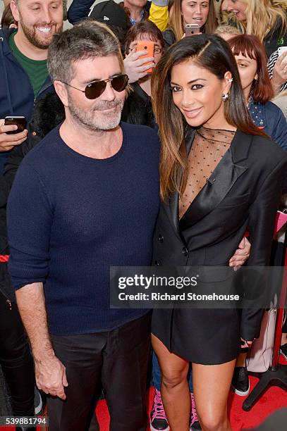 Simon Cowell with Nicole Scherzinger as they arrive for the X Factor Auditions Manchester at Old Trafford on June 13, 2016 in Manchester, England.