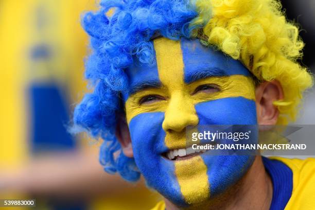 Sweden fan smiles before the Euro 2016 group E football match between Ireland and Sweden at the Stade de France stadium in Saint-Denis, near Paris,...