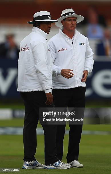 Umpires Kaushal Silva and Rod Tucker talk during day five of the 3rd Investec Test match between England and Sri Lanka at Lord's Cricket Ground on...