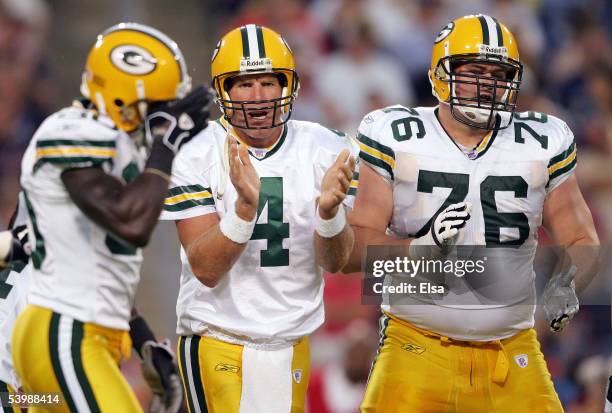 Brett Favre of the Green Bay Packers encourages his teammates in the huddle against the Tennessee Titans during the first half on September 1, 2005...