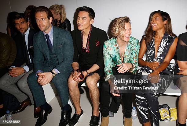 Craig McGinlay, Hun Bing, Dougie Poynter and Naomie Harris attend the Songzio show during The London Collections Men SS17 at BFC Show Space on June...