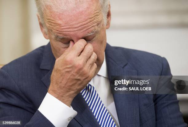 Vice President Joe Biden attends a meeting with US President Barack Obama and top National Security officials about the investigation into the mass...