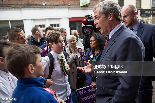 Leader Nigel Farage is confronted by Jacob Chadot, 13 during a walk about on June 13, 2016 in Sittingbourne, England. Mr Chadot asked Mr Farage a...