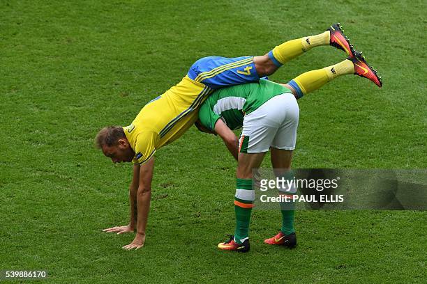 Ireland's forward Shane Long vies with Sweden's defender Andreas Granqvist during the Euro 2016 group E football match between Ireland and Sweden at...