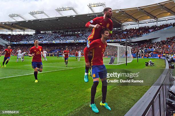 Gerard Pique of Spain celebrates scoring his team's first goal with his team mate Sergio Ramos during the UEFA EURO 2016 Group D match between Spain...