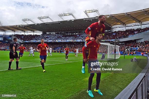 Gerard Pique of Spain celebrates scoring his team's first goal with his team mate Sergio Ramos during the UEFA EURO 2016 Group D match between Spain...