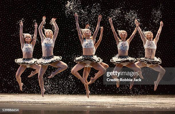 Dancers create a snowstorm at the end of Act One of The Hard Nut, Mark Morris's version of The Nutcracker. Composer: Pyotr Ilyich Tchaikovsky.