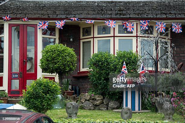 House is covered in Union Jack bunting in Sittingbourne on June 13, 2016. Britain's opposition Labour Party today scrambled to make the case for...