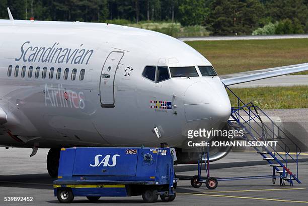 Scandinavian Airlines SAS Boeing 737 aircraft parks at a remote stand at Arlanda airport north of Stockholm, Sweden, June 13, 2016. SAS cancelled 230...