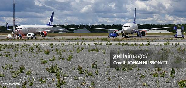 Two Scandinavian Airlines SAS Boeing 737 aircraft park at a remote stand at Arlanda airport north of Stockholm, Sweden, June 13, 2016. SAS cancelled...