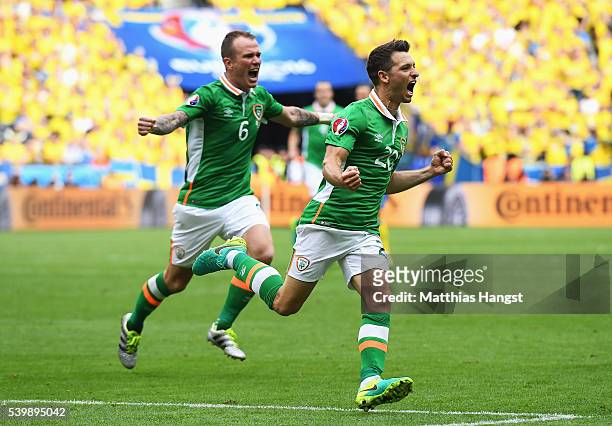Wes Hoolahan of Republic of Ireland celebrates scoring his team's first goal with his team mate Glenn Whelan during the UEFA EURO 2016 Group E match...