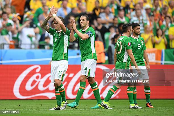 Glenn Whelan, John O'Shea, Robbie Keane and Shane Long of Republic of Ireland react after their 1-1 draw in the UEFA EURO 2016 Group E match between...