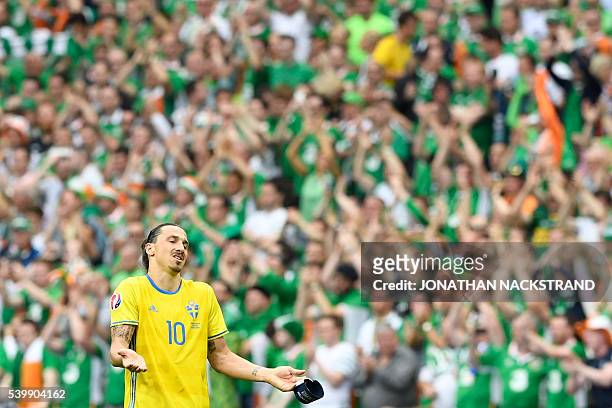 Sweden's forward Zlatan Ibrahimovic gestures at the end of the Euro 2016 group E football match between Ireland and Sweden at the Stade de France...