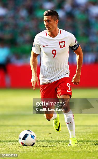 Robert Lewandowski of Poland runs with the ball during the UEFA EURO 2016 Group C match between Poland and Northern Ireland at Allianz Riviera...
