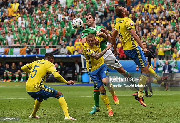 Paris , France - 13 June 2016; John O'Shea of Republic of Ireland in action against Victor Lindelöf of Sweden during the UEFA Euro 2016 Group E match...