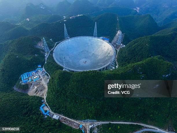 An aerial view of the Five hundred meter Aperture Spherical Telescope on June 10, 2016 in Qiannan Buyei and Miao Autonomous Prefecture, China. After...