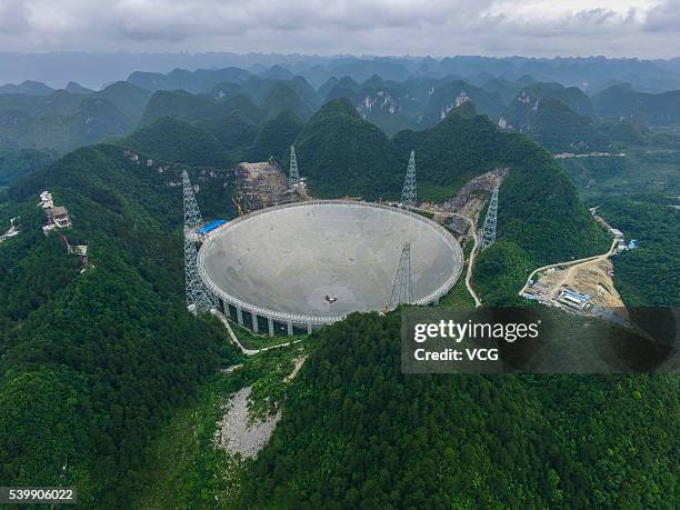 An aerial view of the Five hundred meter Aperture Spherical Telescope on June 10, 2016 in Qiannan Buyei and Miao Autonomous Prefecture, China. After...