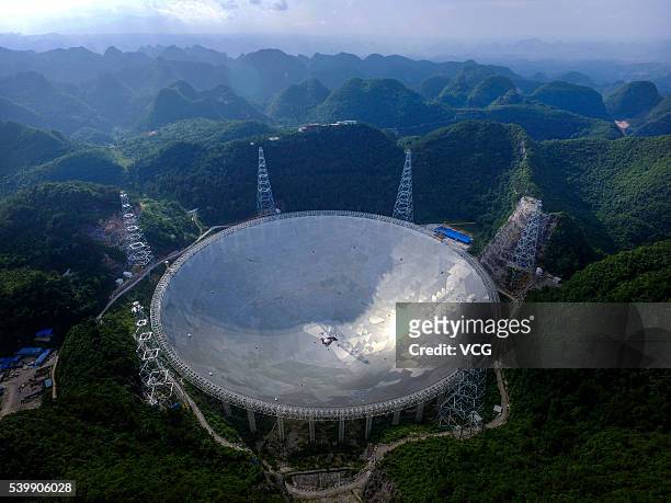 An aerial view of the Five hundred meter Aperture Spherical Telescope on June 10, 2016 in Qiannan Buyei and Miao Autonomous Prefecture, China. After...