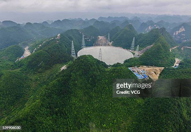 An aerial view of the Five hundred meter Aperture Spherical Telescope on June 10, 2016 in Qiannan Buyei and Miao Autonomous Prefecture, China. After...