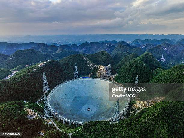 An aerial view of the Five hundred meter Aperture Spherical Telescope on June 10, 2016 in Qiannan Buyei and Miao Autonomous Prefecture, China. After...