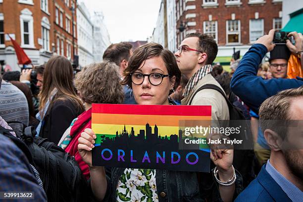 Woman holds a placard during a vigil for the victims of the Orlando nightclub shooting, outside the Admiral Duncan pub on Old Compton Street, Soho on...