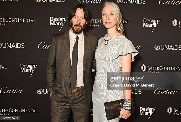 Keanu Reeves and artist Alexandra Grant attend the UNAIDS Gala during Art Basel 2016 at Design Miami/ Basel on June 13, 2016 in Basel, Switzerland.