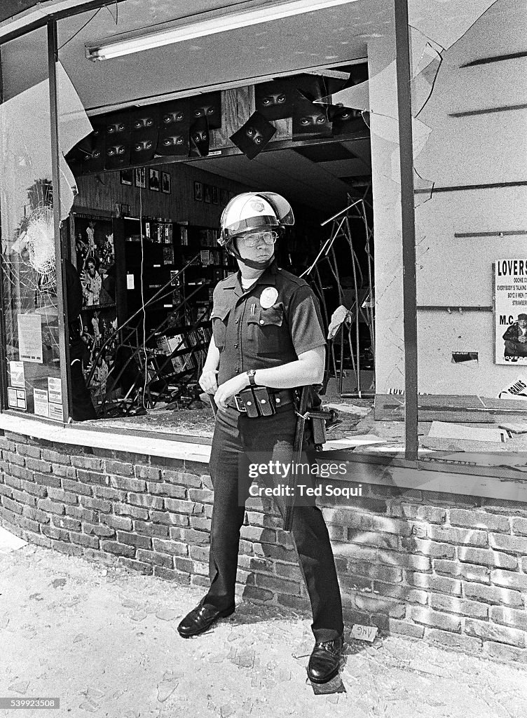 Lapd Riot Officers A LAPD officer in front of a looted record store in South Central ...