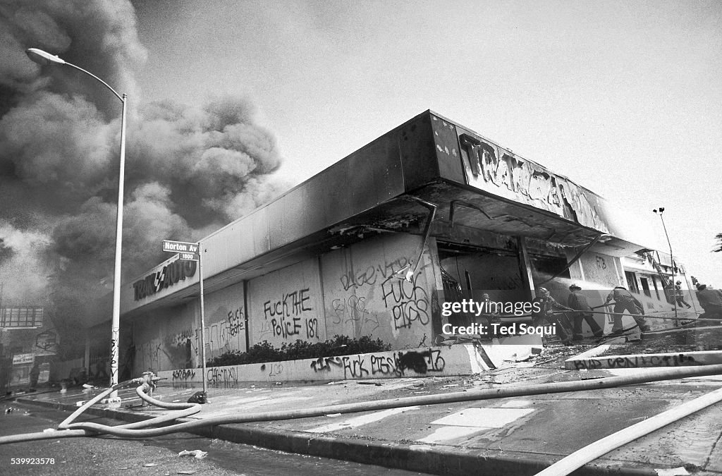 La Riots Vehicles A Trak Auto store is looted and burned on Washington Blvd. near... News ...