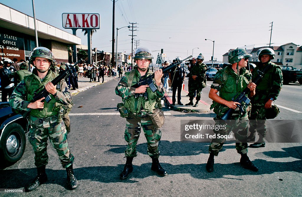 La Riots Nfl Armed National Guard soldiers hold a line in front of a post office ...