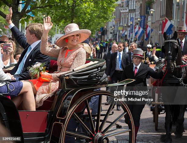 King Willem-Alexander and Queen Maxima of The Netherlands arrives in a horse drawn cart during their regional tour of north west Friesland province...