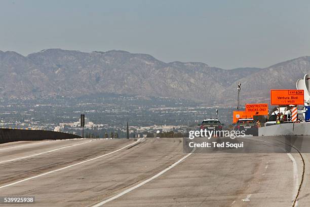 Carmageddon 2 in Los Angeles. Construction crews demolish the Mulholland Bridge over the 405 freeway. The 405 had to be shut down for two days to...