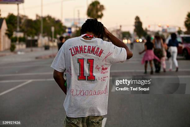 Protesters march through out South Los Angeles in response to the not guilty verdicts in the Trayvon Martin verdict in Florida.