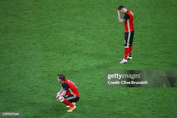 Thomas Vermaelen and Jan Vertonghen of Belgium show their dejection after Italy's second goal during the UEFA EURO 2016 Group E match between Belgium...