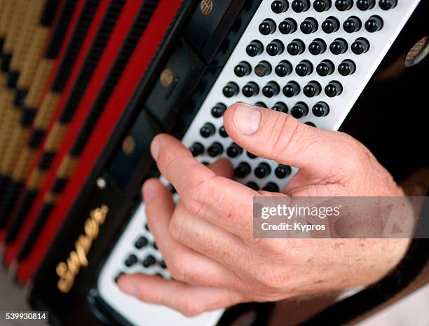 europe, germany, bavaria, view of musician playing piano accordion instrument - accordéon instrument photos et images de collection