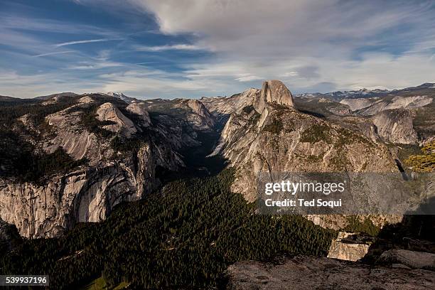 View of Half Dome and the upper valley floor of Yosemite from Glacier Point. Spring time in the Yosemite Valley located inside the Yosemite National...