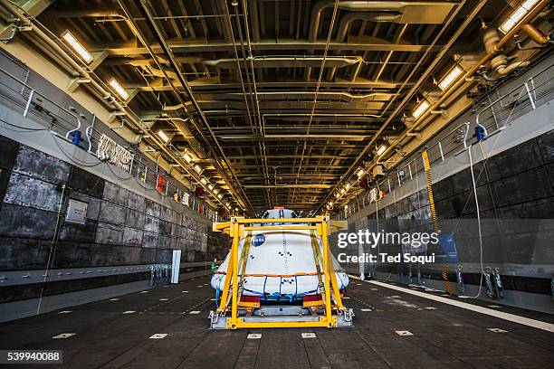 The new Orion space capsule from NASA that will carry astronauts to Mars and back. The USS Anchorage is practicing retrieving the capsule at sea....